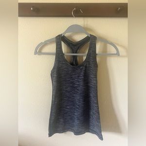 Tank with no attached bra on inner lining. Figure-fitting all around.